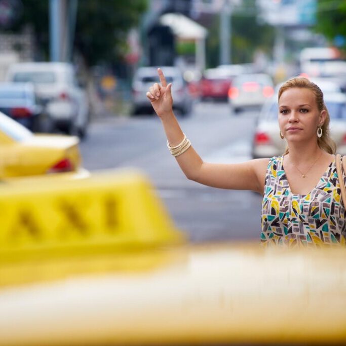 a woman seeking a taxi